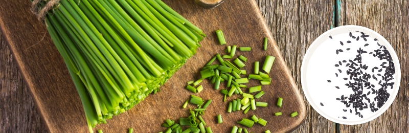 chives cut up on table with seeds