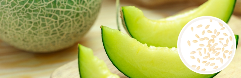 melons cut up on table with seeds