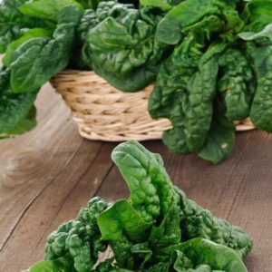 spinach in a basket on a table