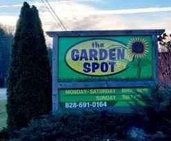 sign saying the garden spot on side of road