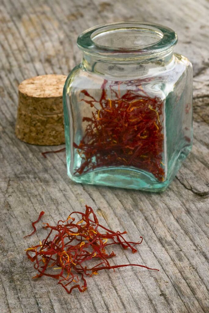 glass jar on table with saffron 